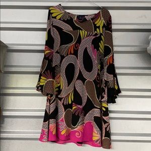 Falls couple inches above knee 5’7”. Flared cuffs